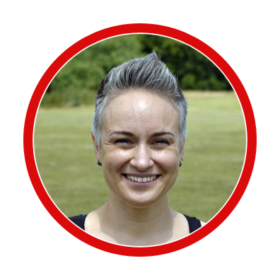 woman's face smiling in field